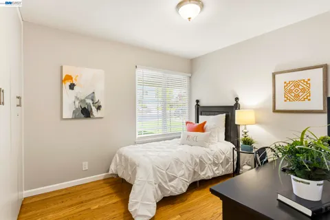 a bedroom with bed and window