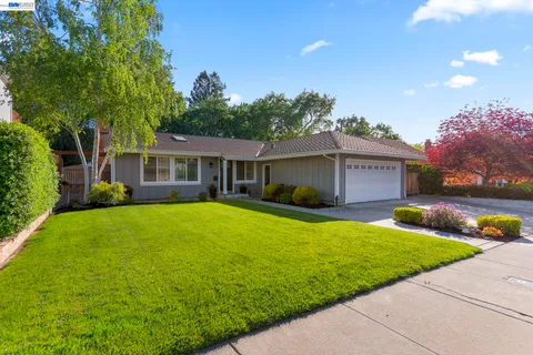 a front view of a house with yard porch and patio