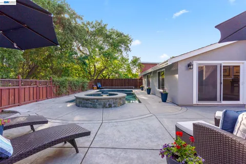 a view of backyard with furniture and outdoor seating