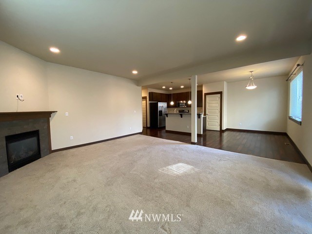 419 203rd Place Southeast Bothell, WA 98012 - Photo 11 of 30 a view of an empty room with a fireplace