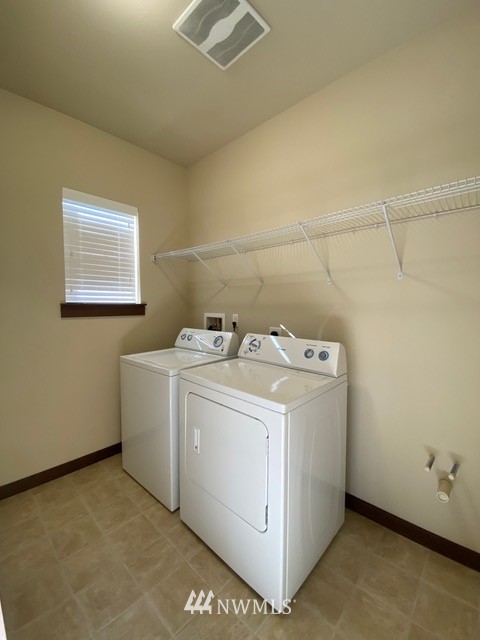 419 203rd Place Southeast Bothell, WA 98012 - Photo 14 of 30 a utility room with dryer and washer