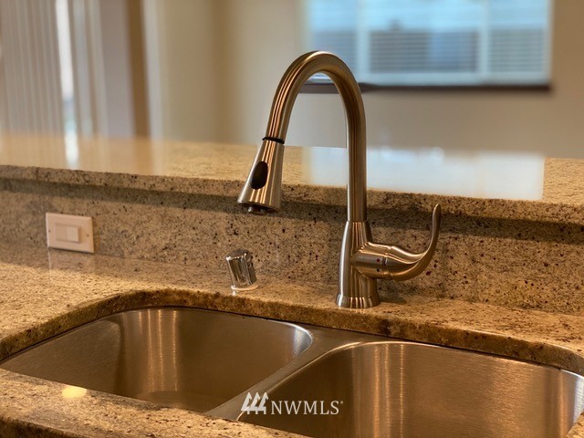 419 203rd Place Southeast Bothell, WA 98012 - Photo 19 of 30 a view of a sink a counter space and a window
