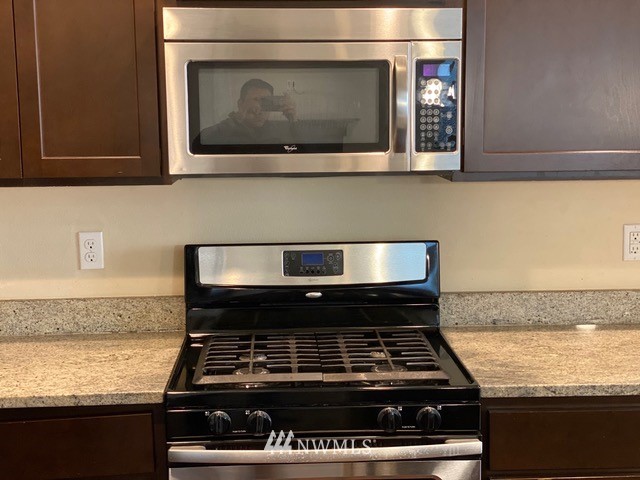 419 203rd Place Southeast Bothell, WA 98012 - Photo 20 of 30 a stove top oven sitting inside of a kitchen