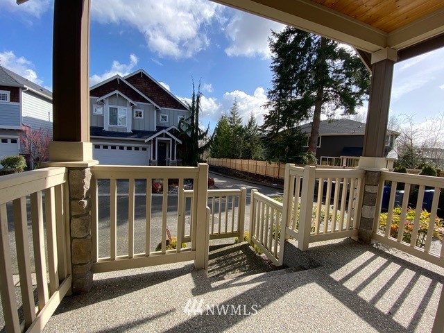 419 203rd Place Southeast Bothell, WA 98012 - Photo 3 of 30 a view of a house with wooden floor and a porch