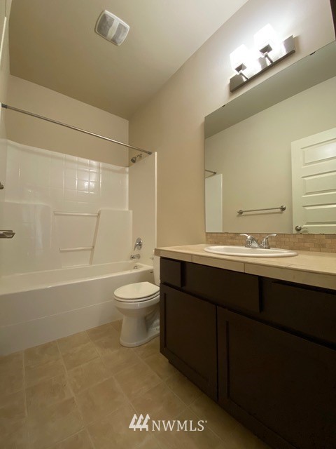 419 203rd Place Southeast Bothell, WA 98012 - Photo 23 of 30 a bathroom with a sink a toilet and shower