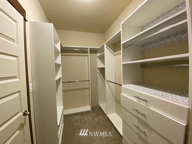 419 203rd Place Southeast Bothell, WA 98012 - Photo 30 of 30 a view of walk in closet with empty racks