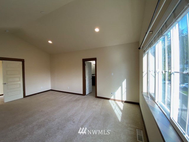 419 203rd Place Southeast Bothell, WA 98012 - Photo 6 of 30 a view of empty room with wooden floor and fan