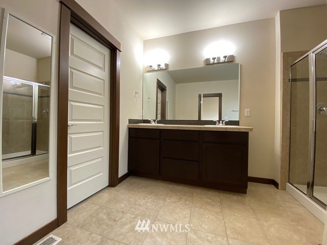 419 203rd Place Southeast Bothell, WA 98012 - Photo 10 of 30 a bathroom with a sink and a mirror