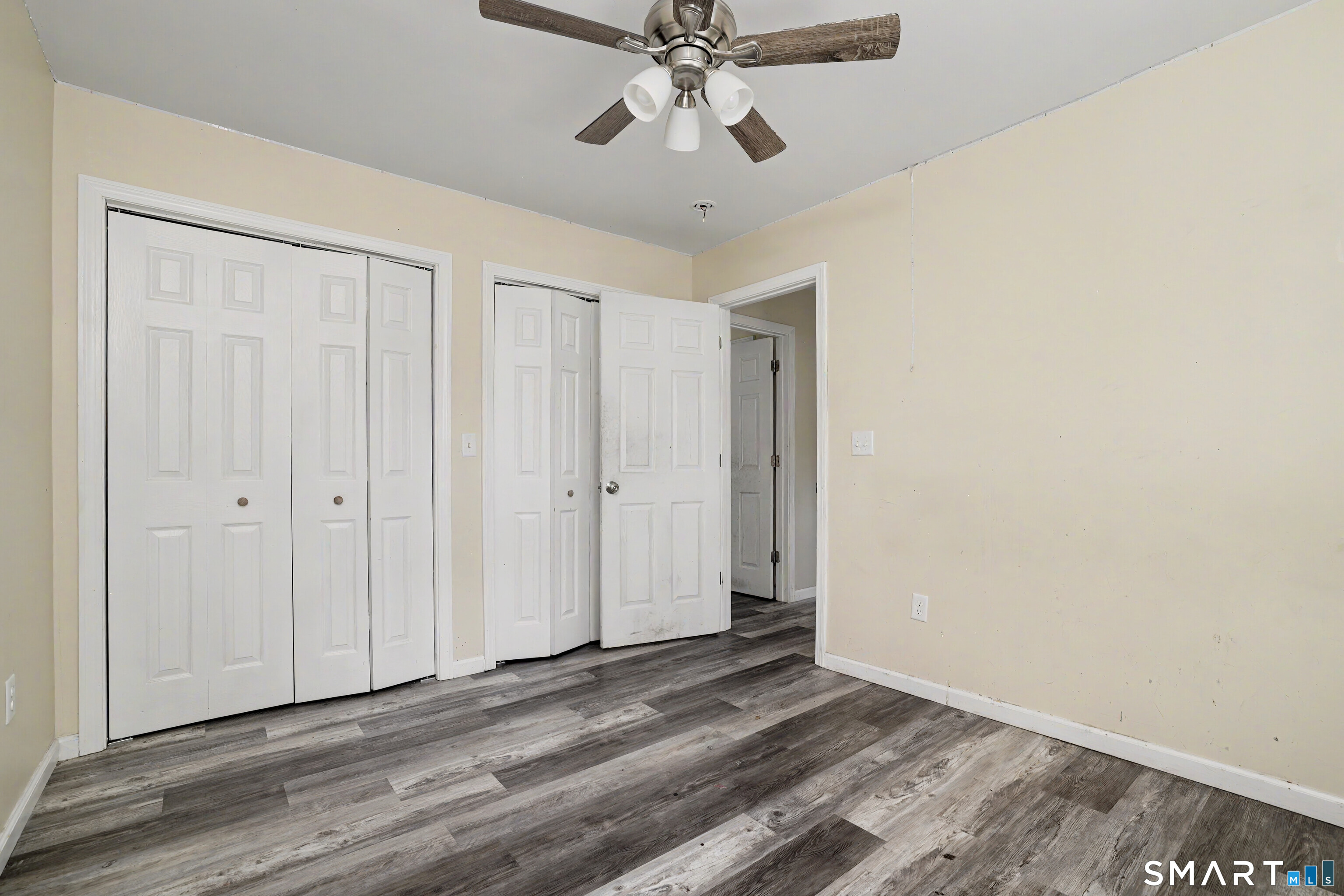 97 Boothbay Street Bloomfield, CT 06002 - Photo 24 of 33 a view of a room with wooden floor and ceiling fan