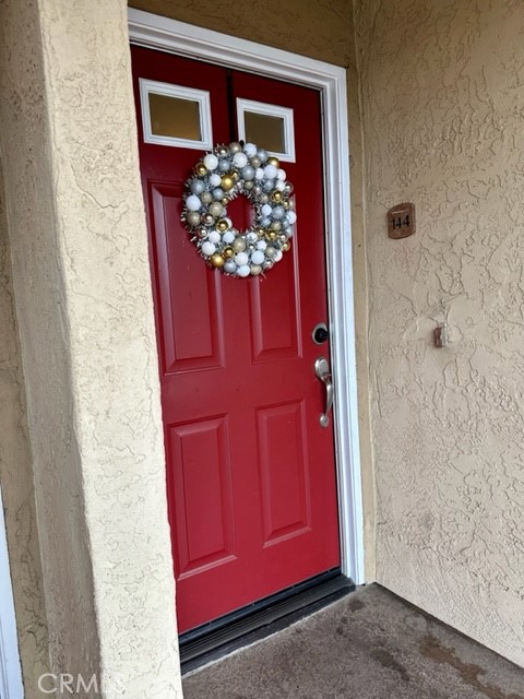 495 San Pasqual Valley Road, Unit 144 Escondido, CA 92025 - Photo 1 of 1 view of a house with a red door