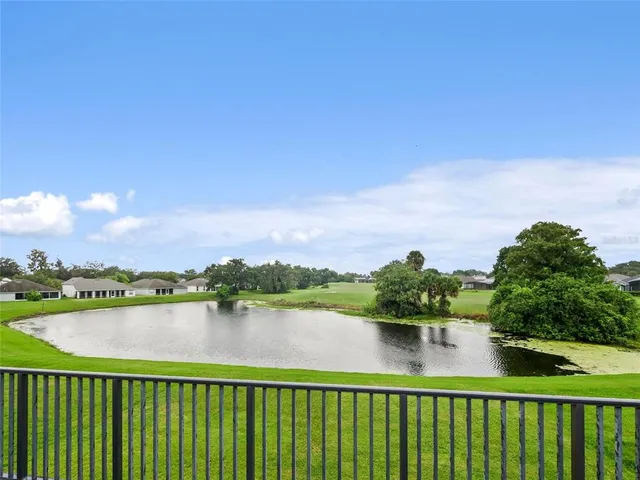 a view of lake and houses with outdoor space