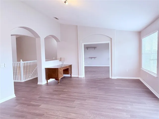 front view of a brick house with a yard