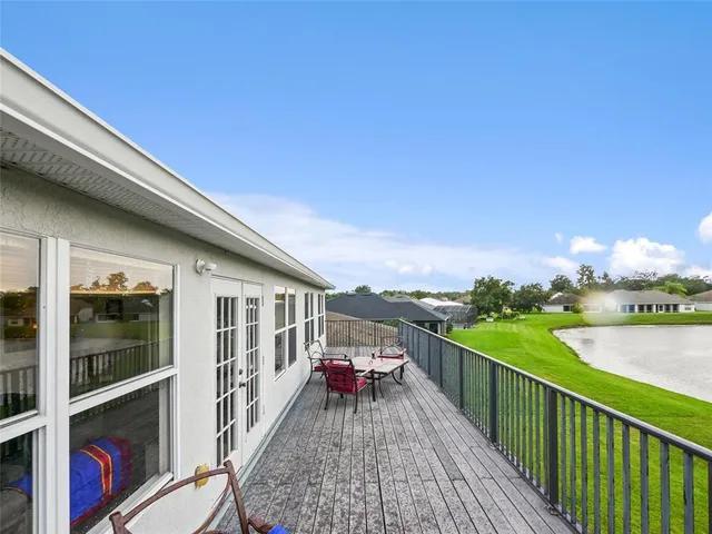 a view of a balcony with two chairs