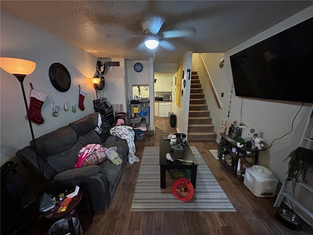4405 Carter Creek Parkway, Unit 9 Bryan, TX 77802 - Photo 3 of 11 a living room with furniture and a flat screen tv