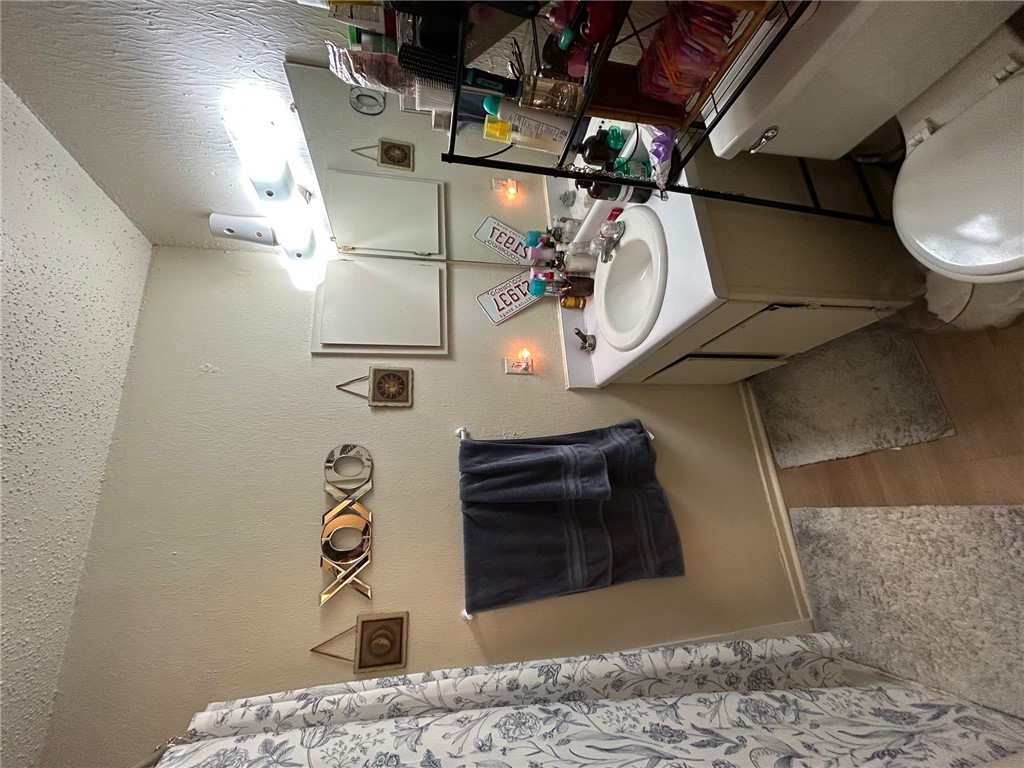 4405 Carter Creek Parkway, Unit 9 Bryan, TX 77802 - Photo 8 of 11 a bathroom with a sink toilet and mirror