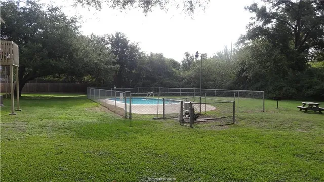 a view of a park with a slide