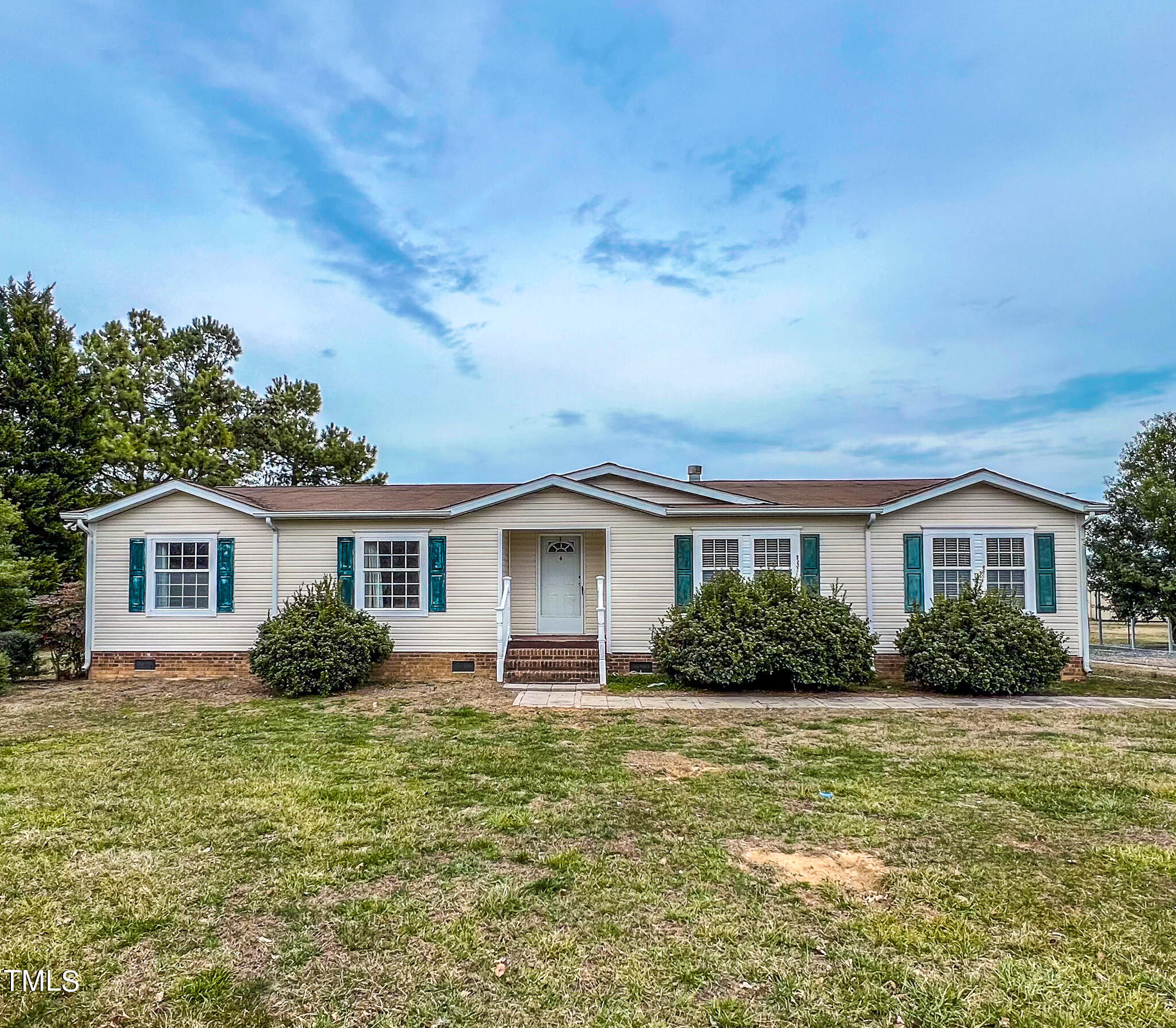 733 Oliver Loop Road Roxboro, NC 27574 - Photo 1 of 28 a front view of a house with a yard