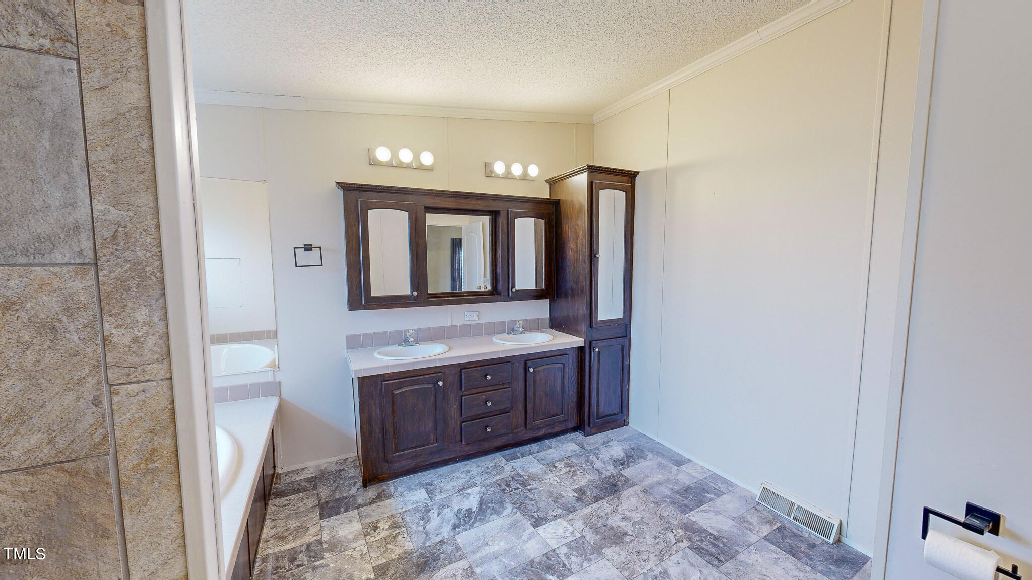 733 Oliver Loop Road Roxboro, NC 27574 - Photo 11 of 28 a bathroom with a sink and a mirror