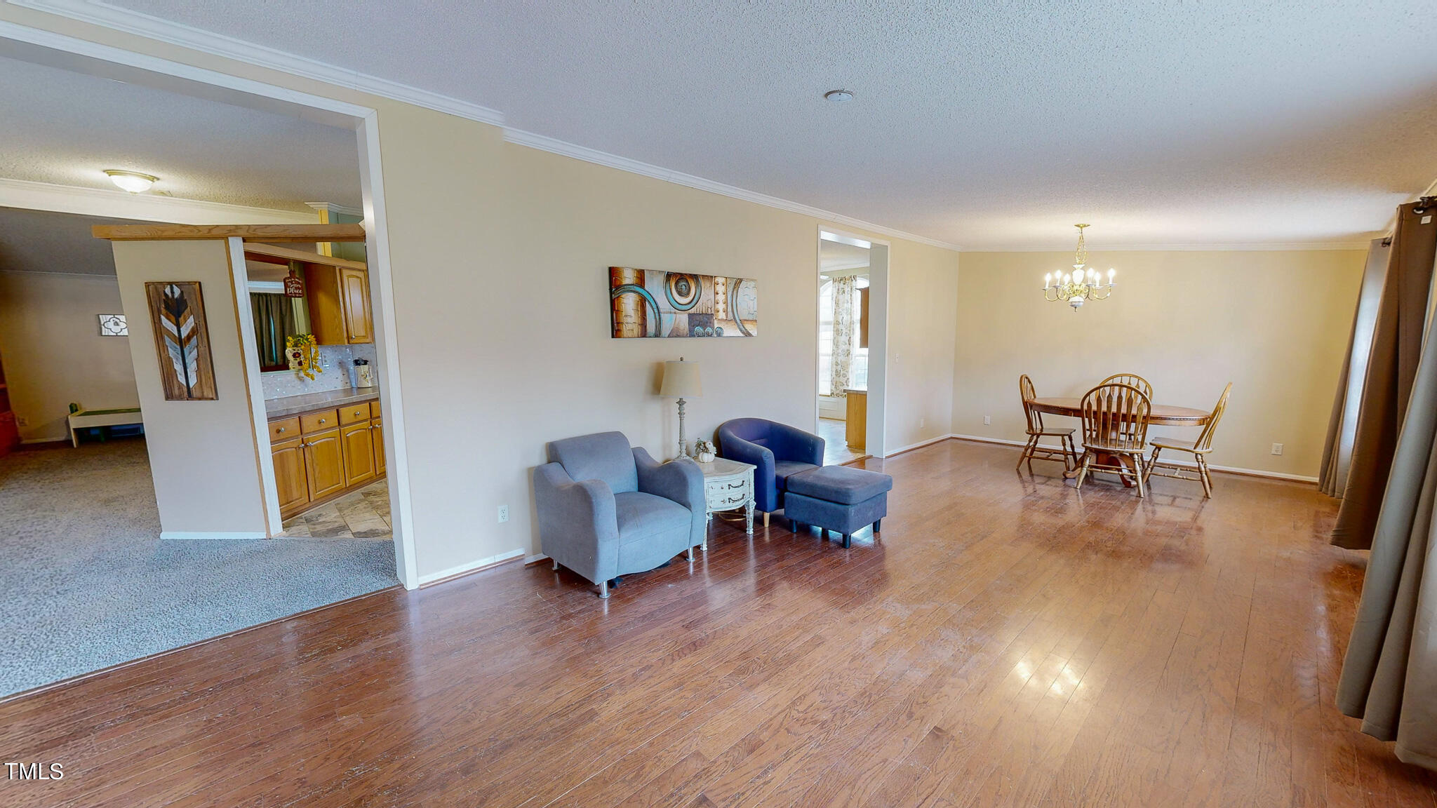 733 Oliver Loop Road Roxboro, NC 27574 - Photo 7 of 28 a living room with furniture and a wooden floor