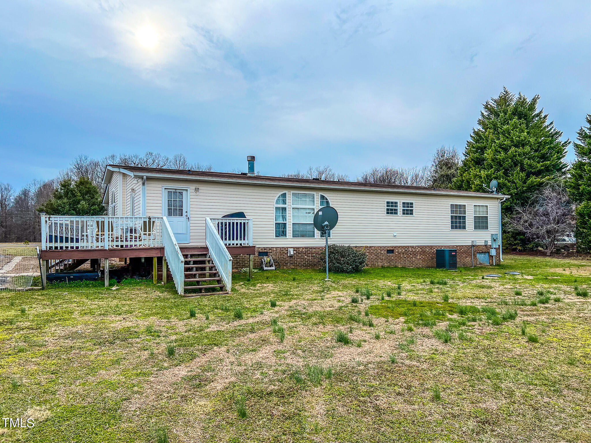 733 Oliver Loop Road Roxboro, NC 27574 - Photo 8 of 28 a backyard of a house with yard barbeque oven and outdoor seating