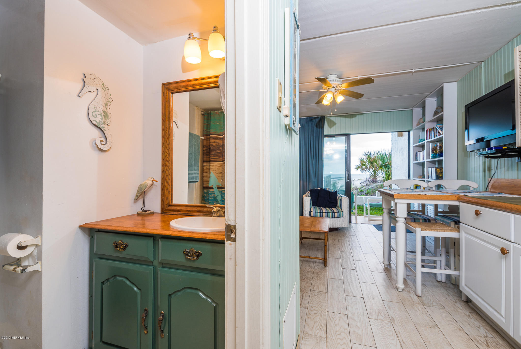 6970 A1A South, Unit 133 St. Augustine, FL 32080 - Photo 14 of 26 a kitchen with a sink and a refrigerator