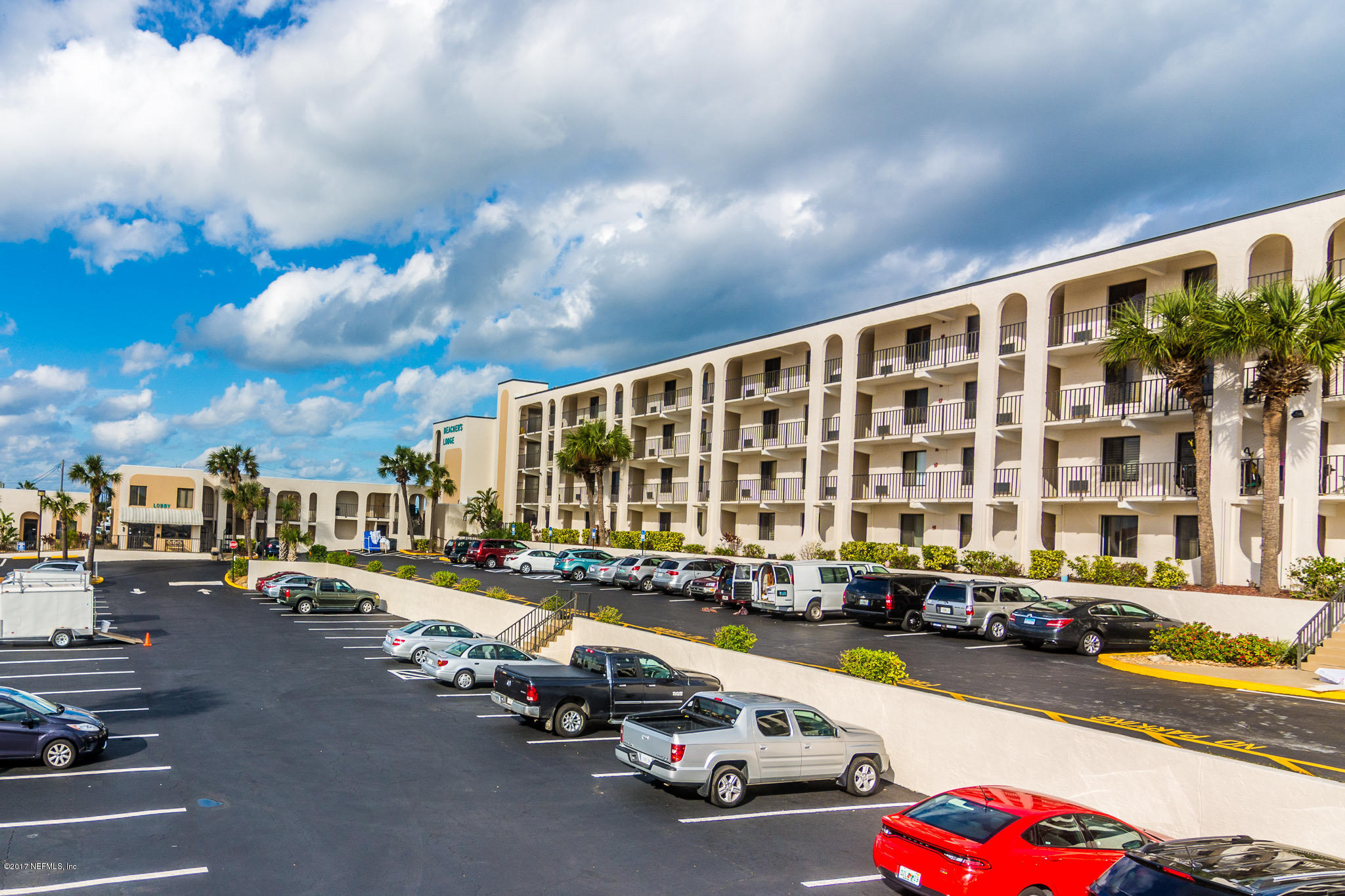 6970 A1A South, Unit 133 St. Augustine, FL 32080 - Photo 25 of 26 a city street lined with parked cars and buildings