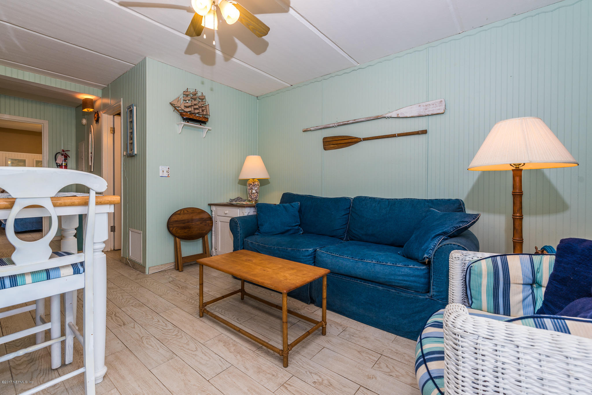 6970 A1A South, Unit 133 St. Augustine, FL 32080 - Photo 4 of 26 a living room with furniture and a baby crib