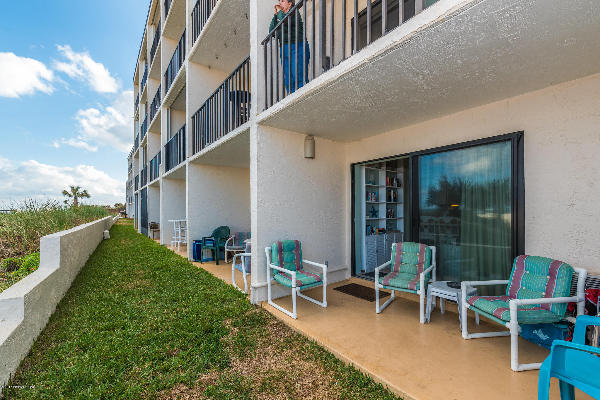 6970 A1A South, Unit 133 St. Augustine, FL 32080 - Photo 10 of 26 a balcony with table and chairs