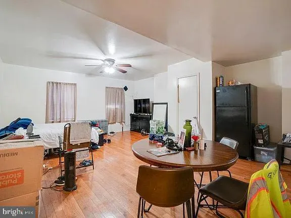 a view of a dining room with furniture and a chandelier