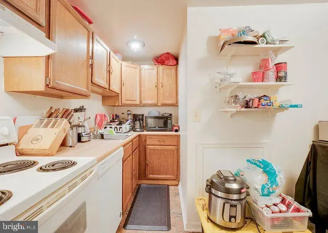 a kitchen with a refrigerator and cabinets