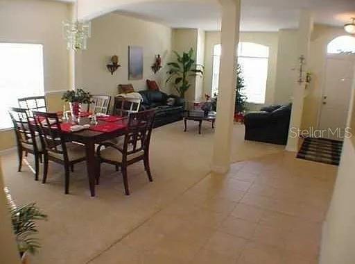 1237 Portmoor Way Winter Garden, FL 34787 - Photo 3 of 9 a dining room with furniture and wooden floor