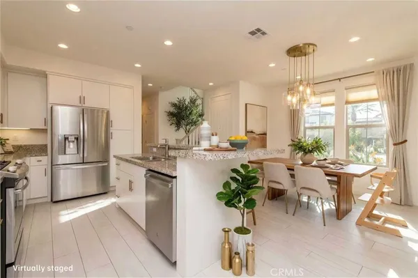 a bathroom with a granite countertop sink a toilet and a mirror