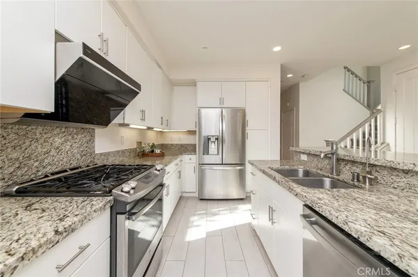 a view of house with backyard