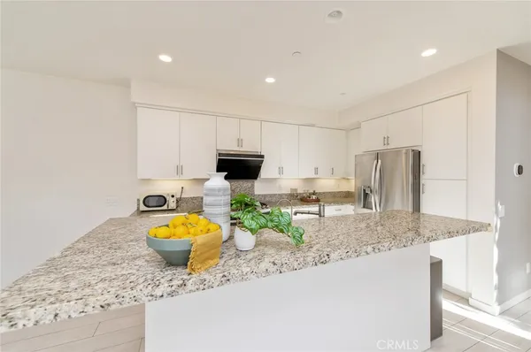 a bedroom with bed and wooden floor
