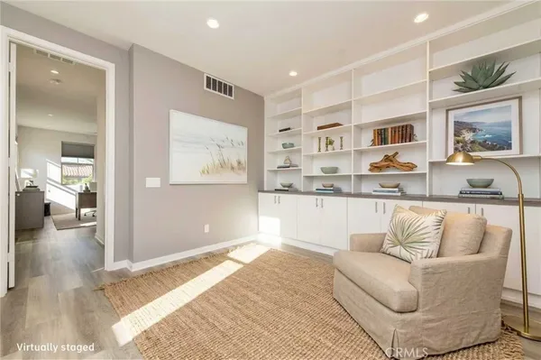 a spacious bedroom with a bed and a window