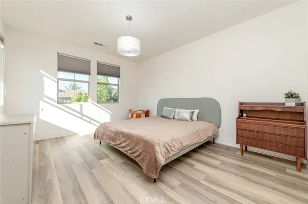 a view of a workspace with wooden floor