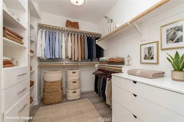 a view of a patio with a table and chairs under an umbrella