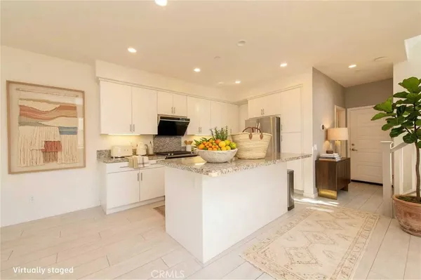 a spacious bedroom with a bed and a large window