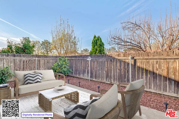 a outdoor living space with furniture and a potted plant