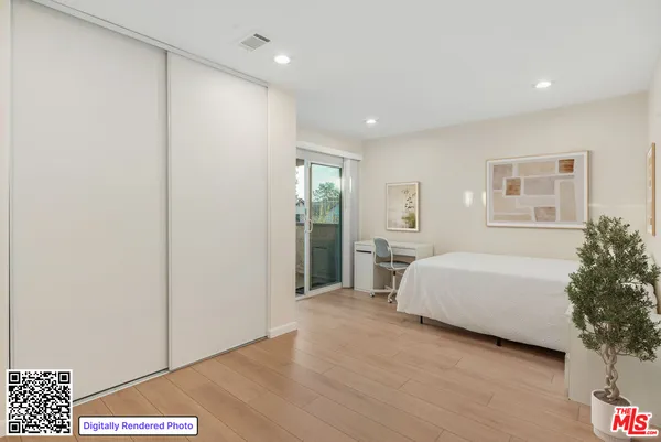 a spacious bedroom with a bed and a window