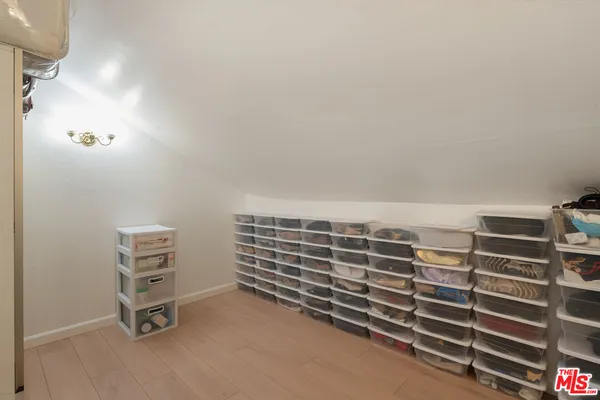 a view of an empty room with empty shelves