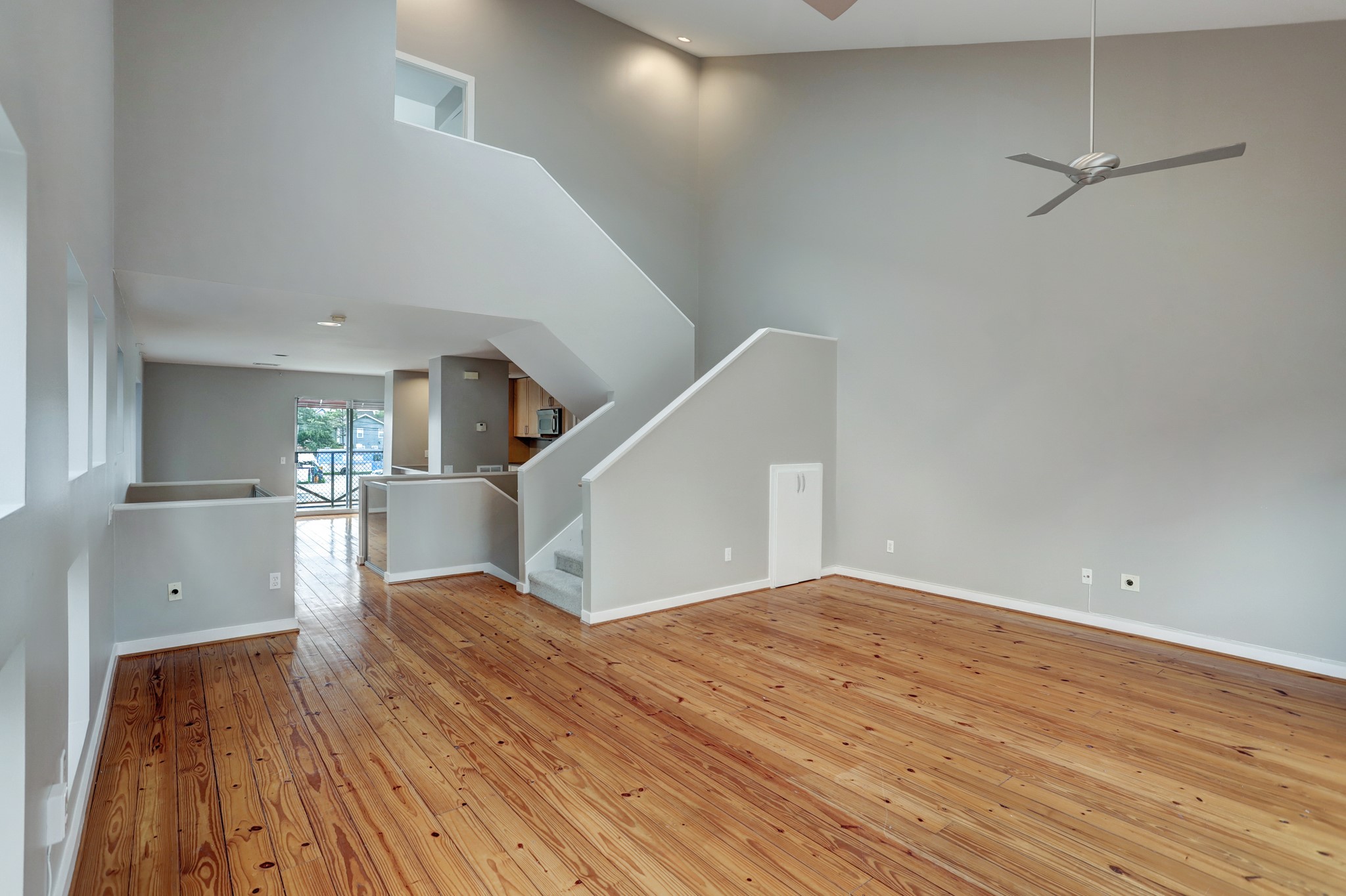 835 Saulnier Street Houston, TX 77019 - Photo 2 of 10 a view of empty room with wooden floor