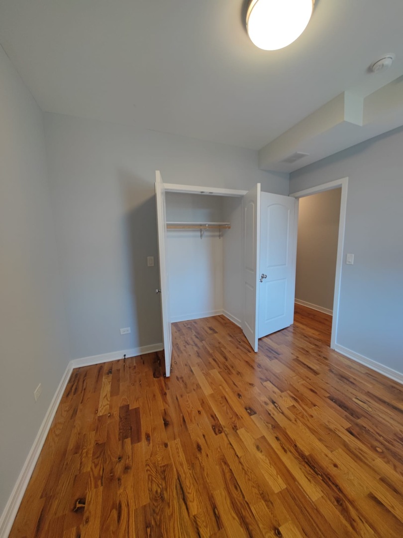 4201 West Division Street, Unit 2 Chicago, IL 60651 - Photo 3 of 7 a view of room with wooden floor