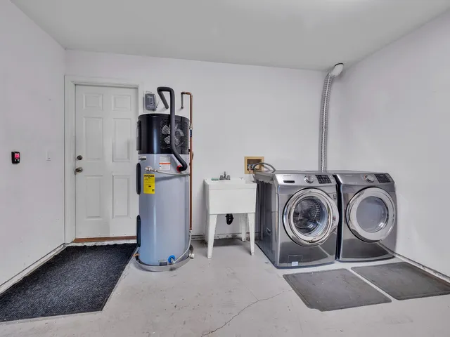a utility room with dryer and washer