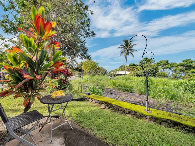 a view of swimming pool with a table and chairs