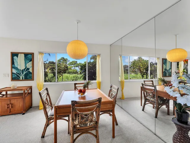 a view of a dining room with furniture window and outside view