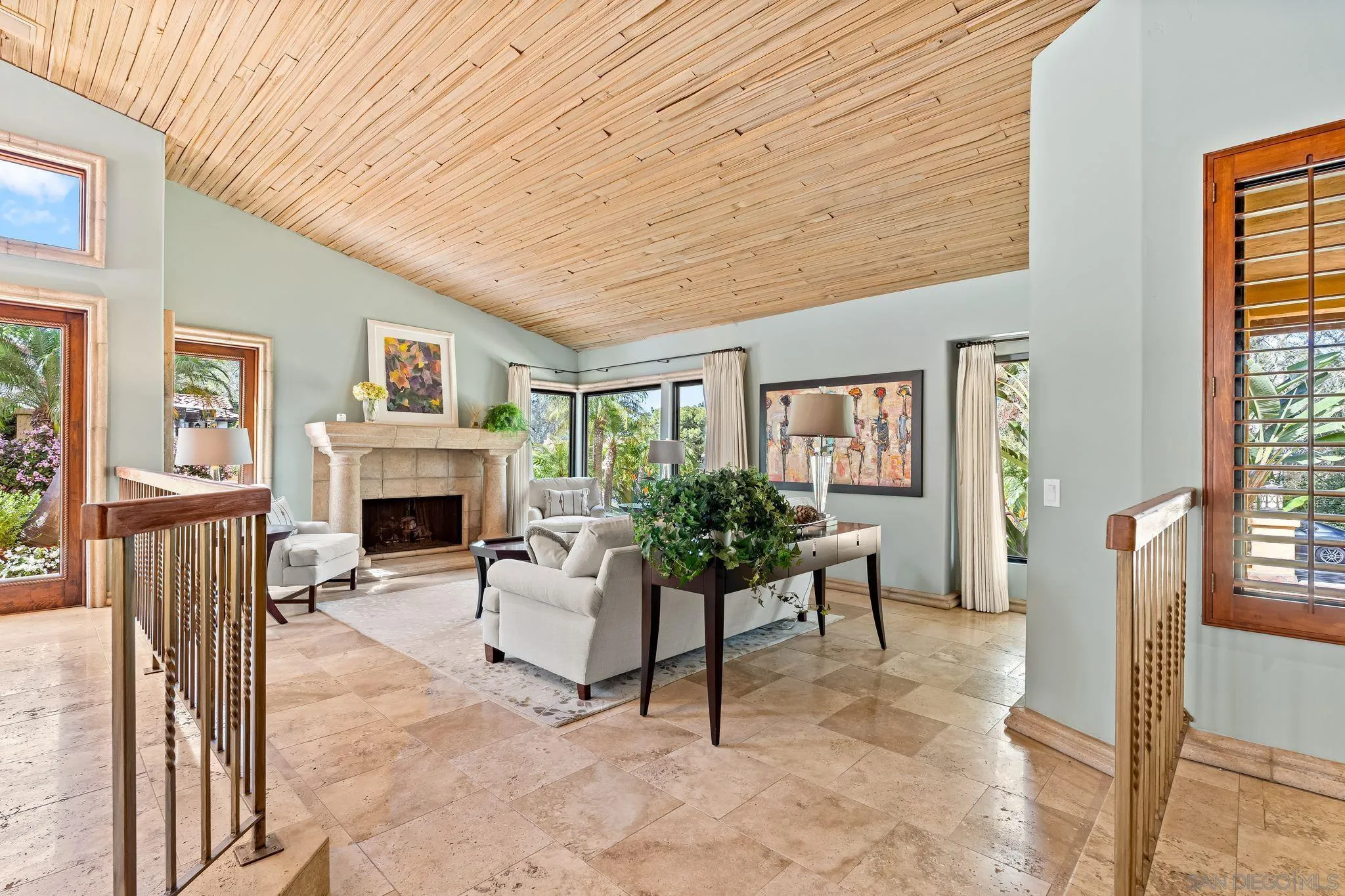 2969 Racetrack View Drive Del Mar, CA 92014 - Photo 7 of 59 a living room with furniture a fireplace and a table