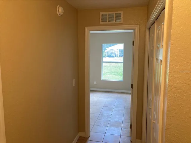 view of hall way with mirror