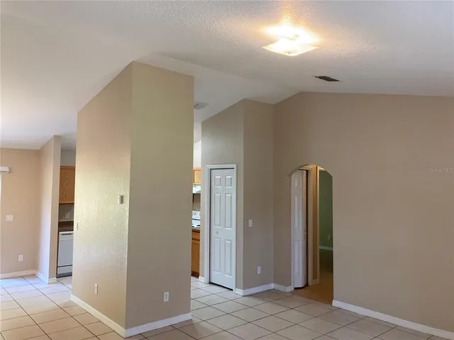 a kitchen with stainless steel appliances granite countertop a refrigerator and a stove