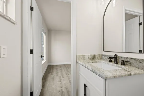 a bathroom with a sink and a mirror